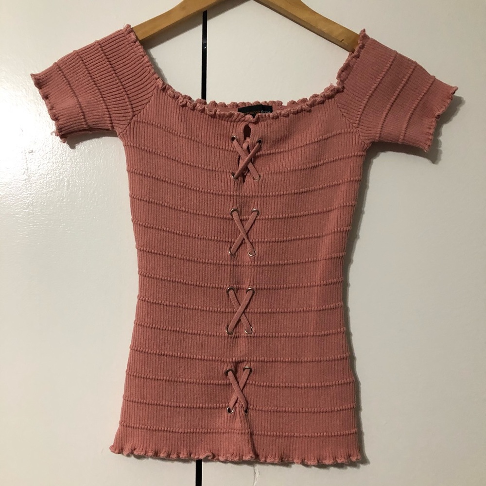 Over the shoulder front lace up top